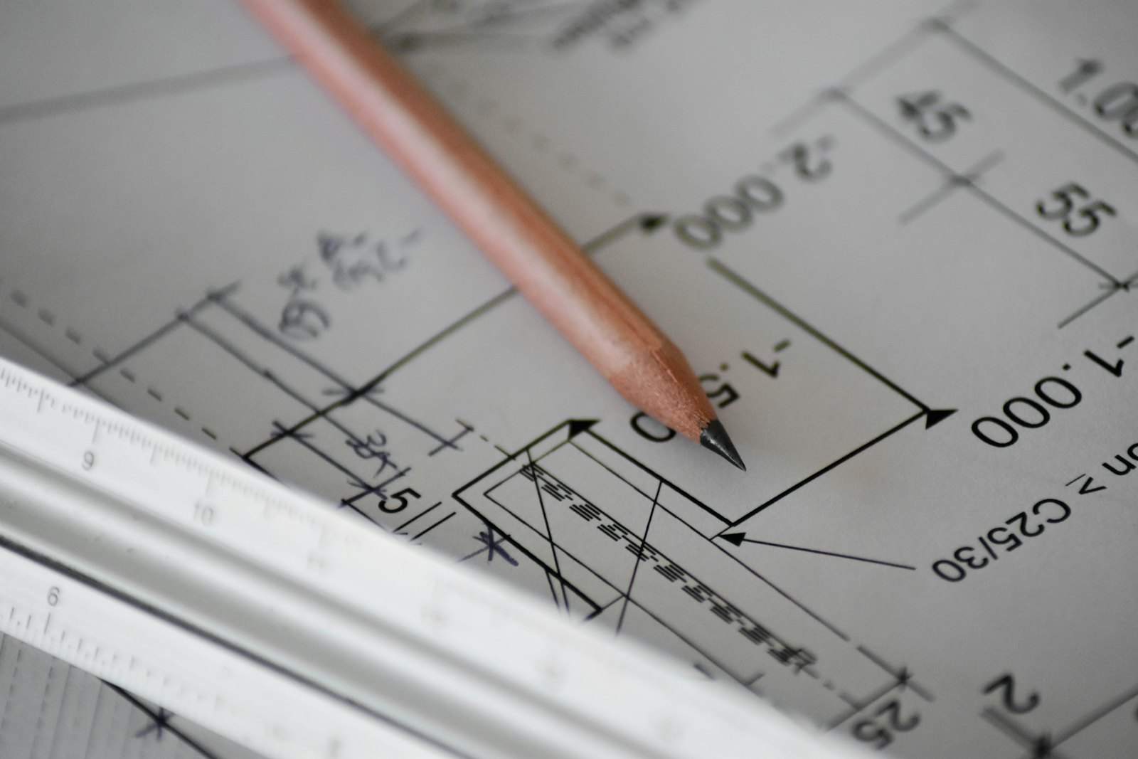 Construction drawings and a ruler on a desk