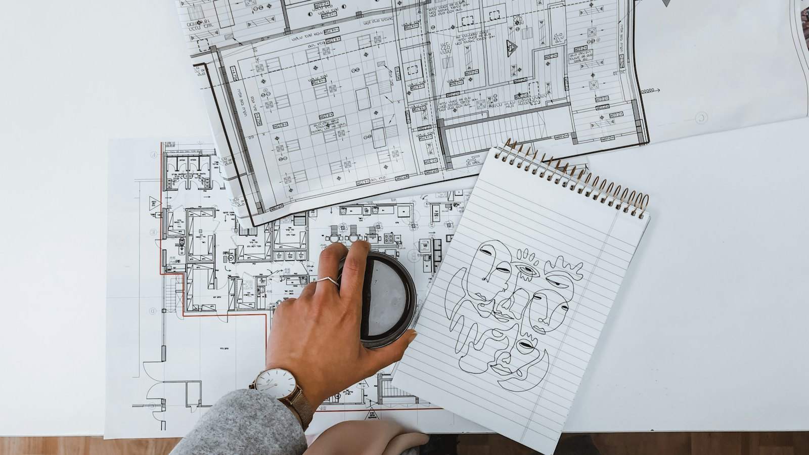 Floor plans being reviewed at a desk