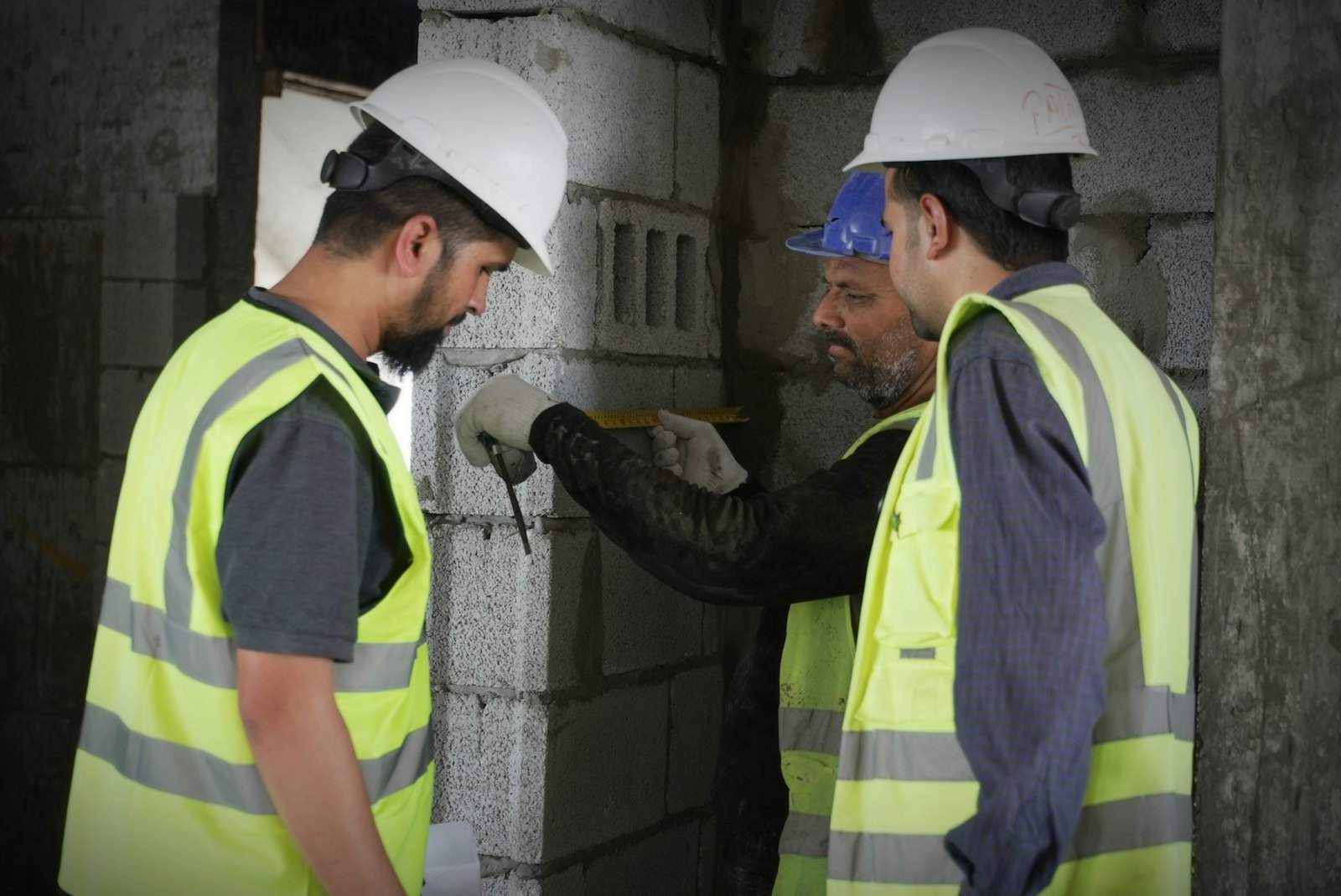 Surveyor inspecting building work on site